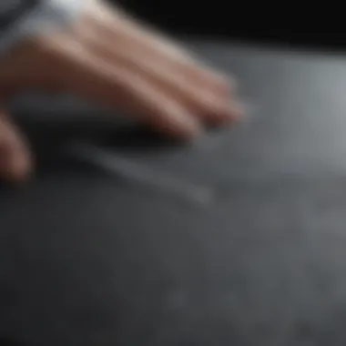 Using a Microfiber Cloth on an LCD Screen Close-up of a microfiber cloth gently cleaning an LCD screen