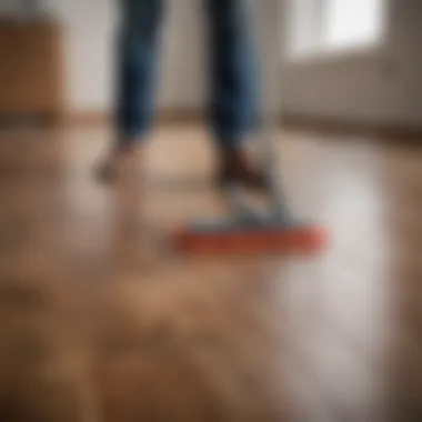 A person demonstrating a cleaning technique on a laminate floor