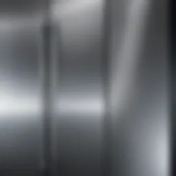 Close-up of a pristine stainless steel refrigerator surface reflecting light