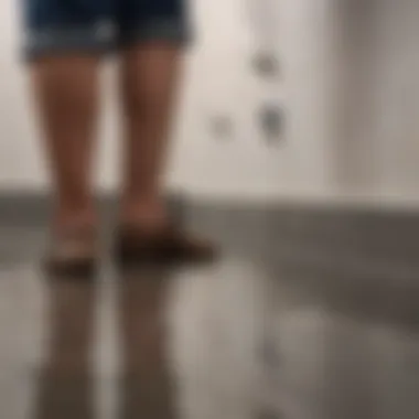 Professional plumber assessing a shower drain issue